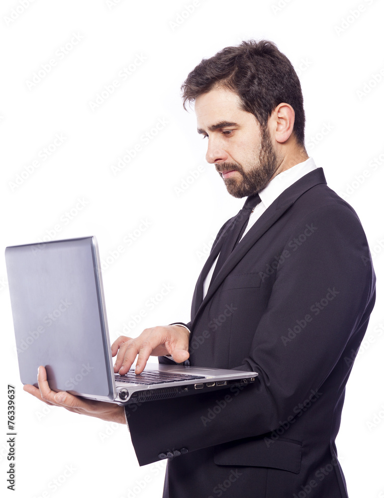 Business man holding a laptop computer, isolated on a white back Business man holding a laptop computer, isolated on a white back