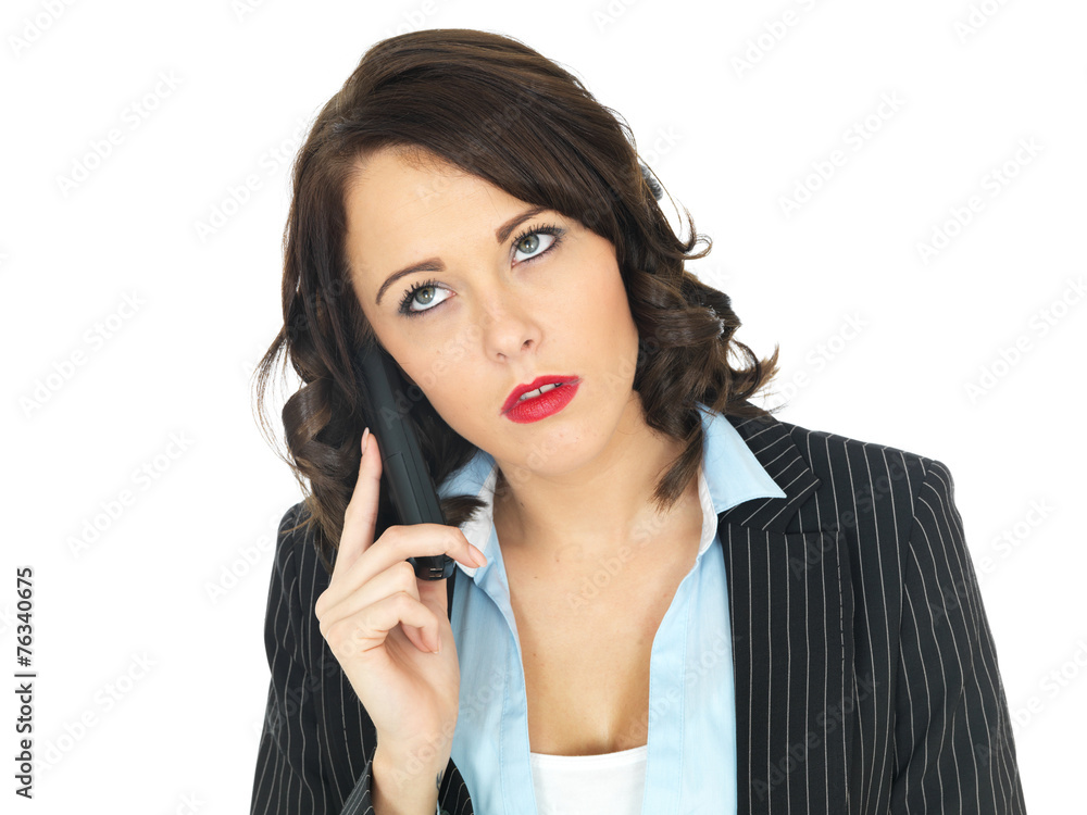 Young Business Woman Using a Telephone Young Business Woman Using a Telephone