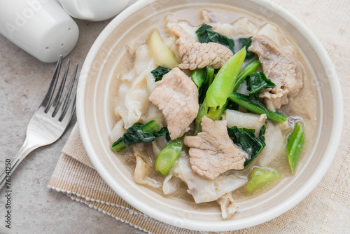 Fried noodle with pork and kale soaked in gravy