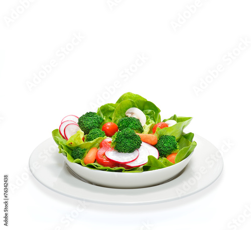 Fruit and vegetable salad in a bowl isolated on white
