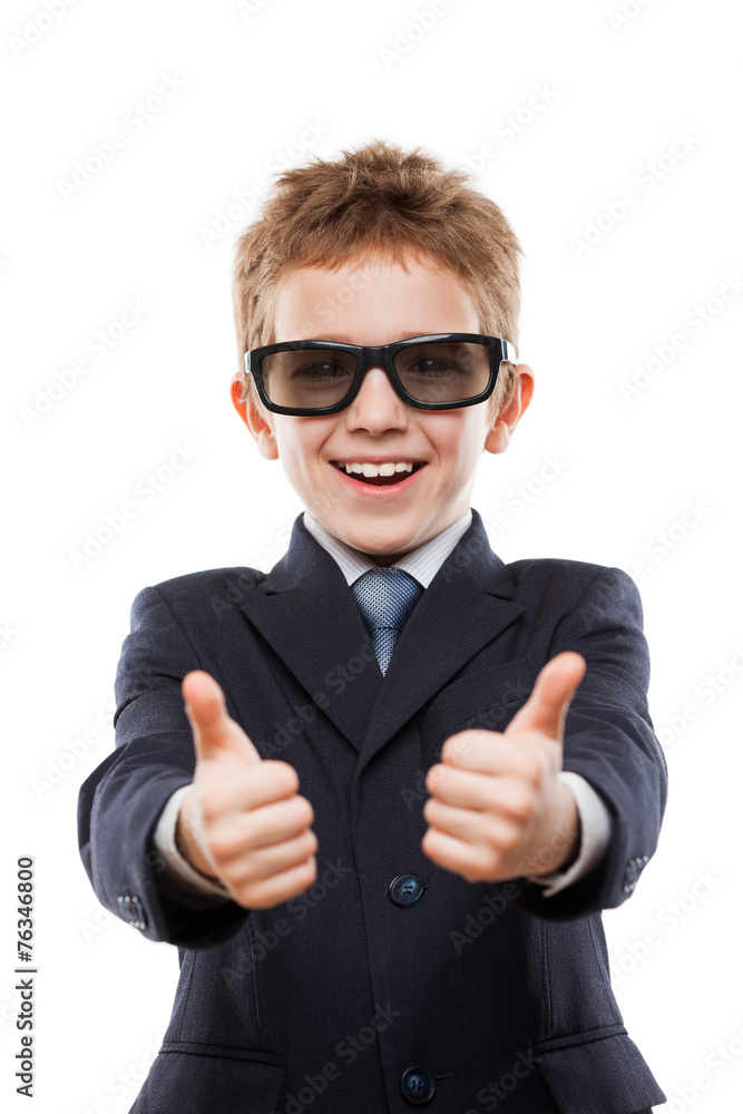 Smiling child boy in business suit wearing sunglasses gesturing Smiling child boy in business suit wearing sunglasses gesturing