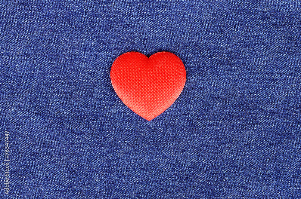 Heart shape on blue jeans texture