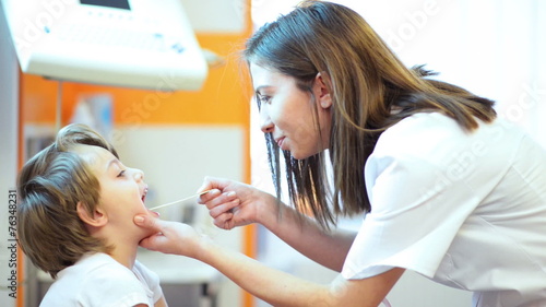 Wallpaper Mural Cute boy being checked in throat Torontodigital.ca