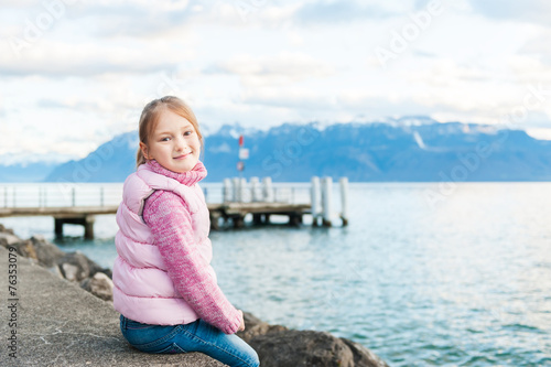 Outdoor portrait of adorable little girl © annanahabed