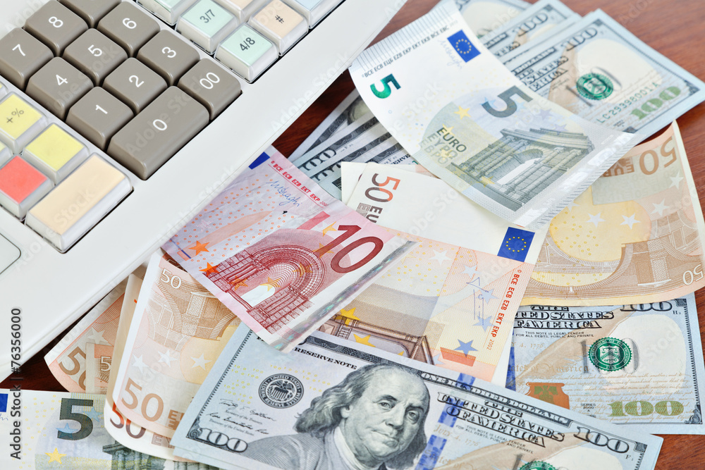 Cash register and different paper currencies foreground Cash register and different paper currencies foreground