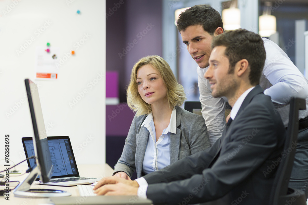 Group of business people at office, working on computer Group of business people at office, working on computer
