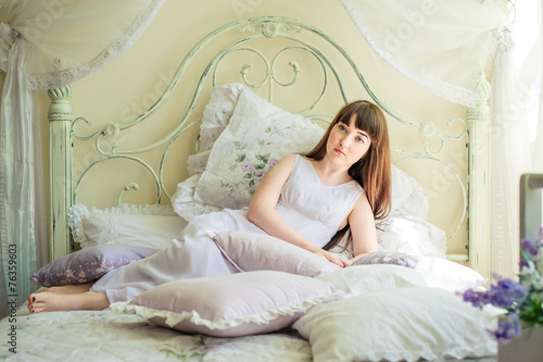 one young girl on the bed © PBaishev
