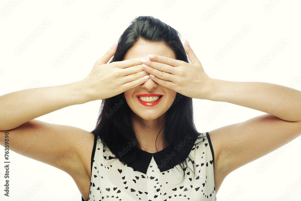 young woman covering her eyes with her hands.