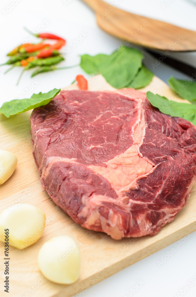 Raw Fresh Meat Slices on Wooden Chopping Board. Raw Fresh Meat Slices on Wooden Chopping Board.