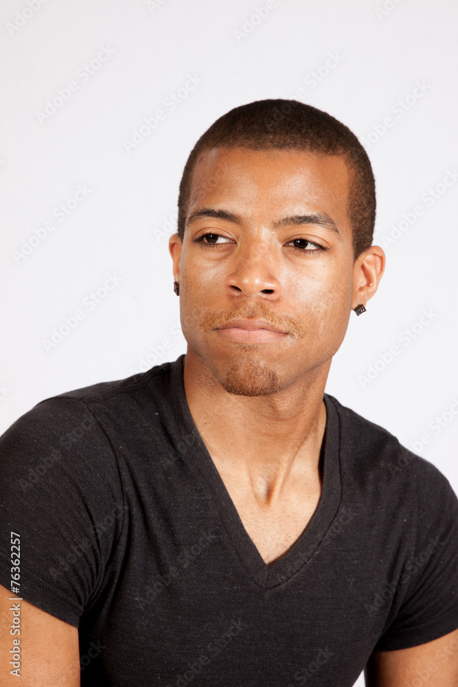 Black man looking thoughtful Black man looking thoughtful