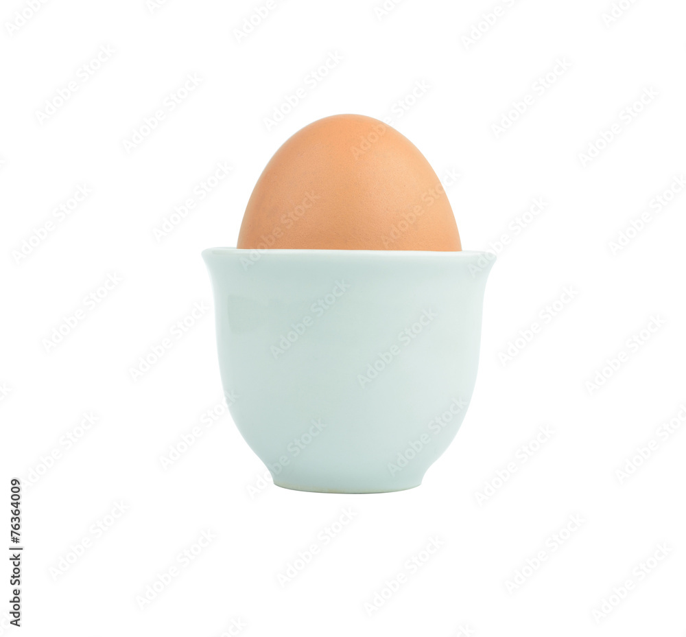 egg in egg cup isolated on white background egg in egg cup isolated on white background