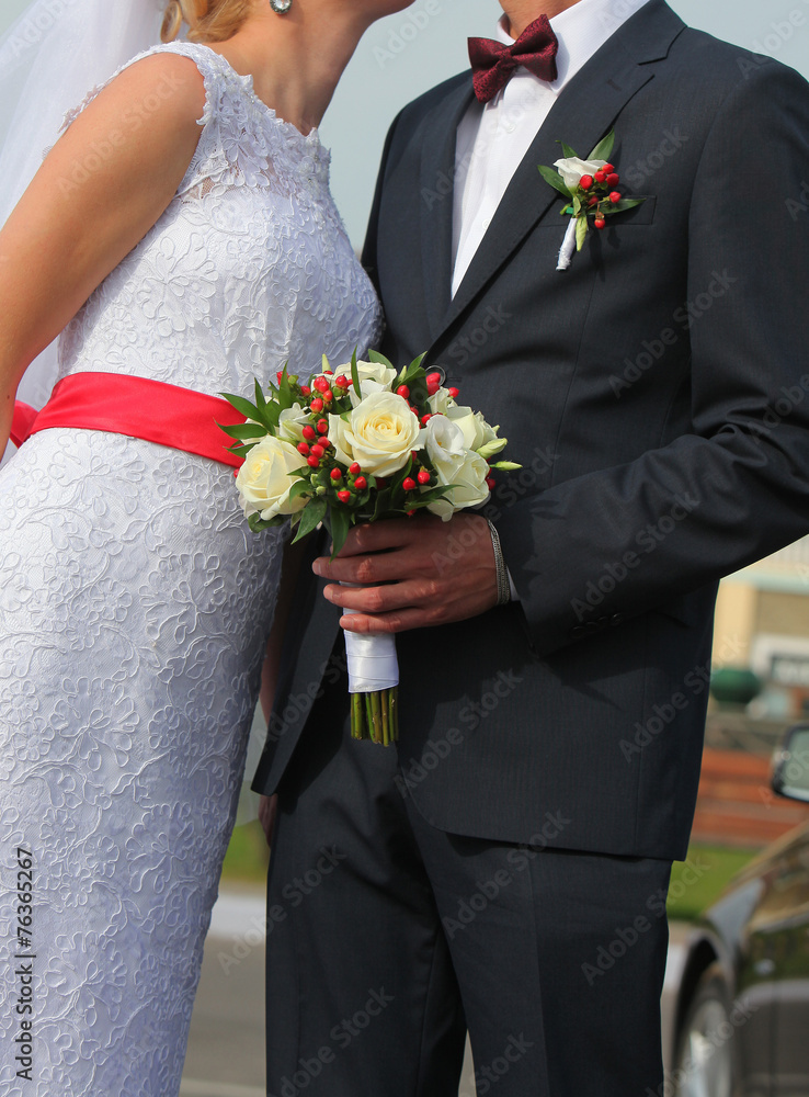 Bright festive wedding bouquet in hands of the bride in a dress Bright festive wedding bouquet in hands of the bride in a dress