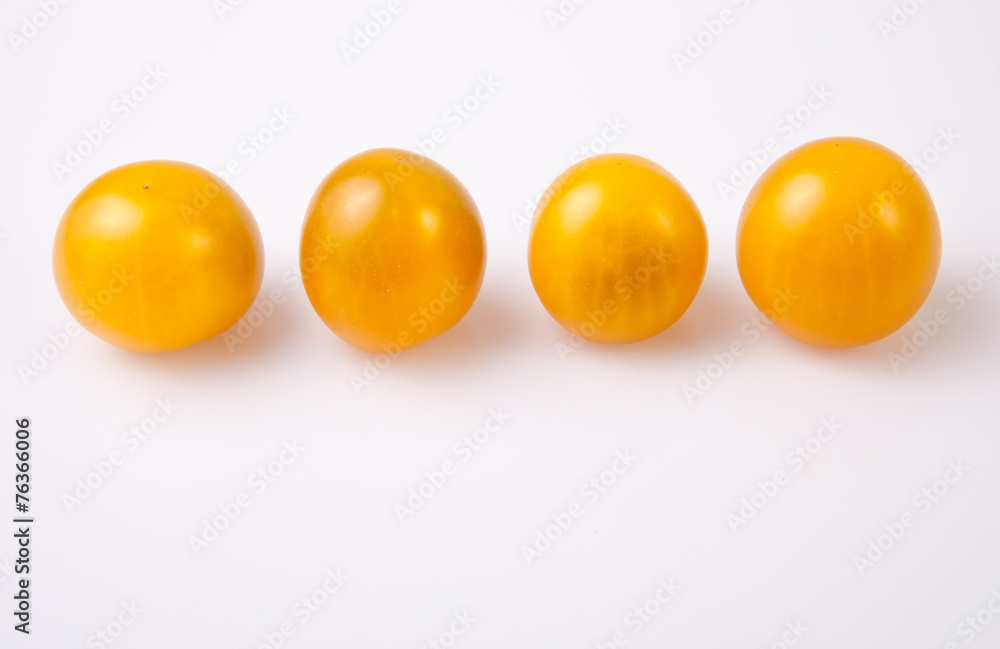 Yellow shiny cherry tomatoes