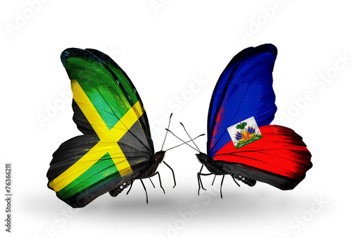 Two butterflies with flags Jamaica and Haiti photo