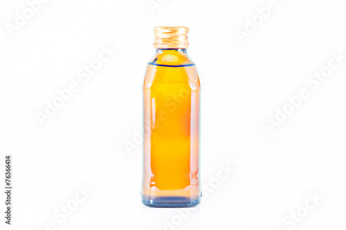 yellow glass bottle on a white background.
