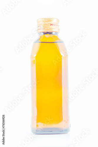 yellow glass bottle on a white background.
