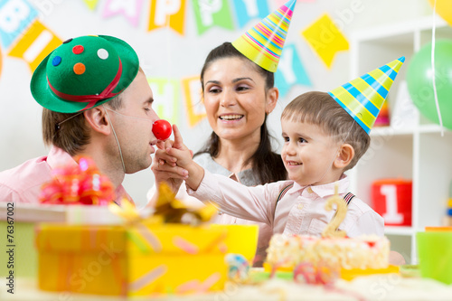 family playing on child birthday