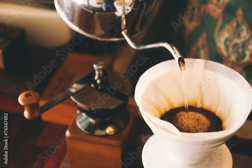 vintage color tone : cup of coffee in coffee shop