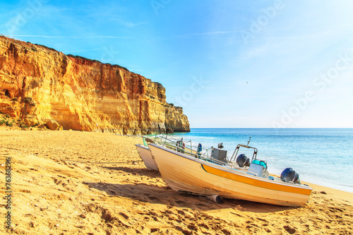 Boats on a Praia de Benagil in Algarve region, Portugal, Europe