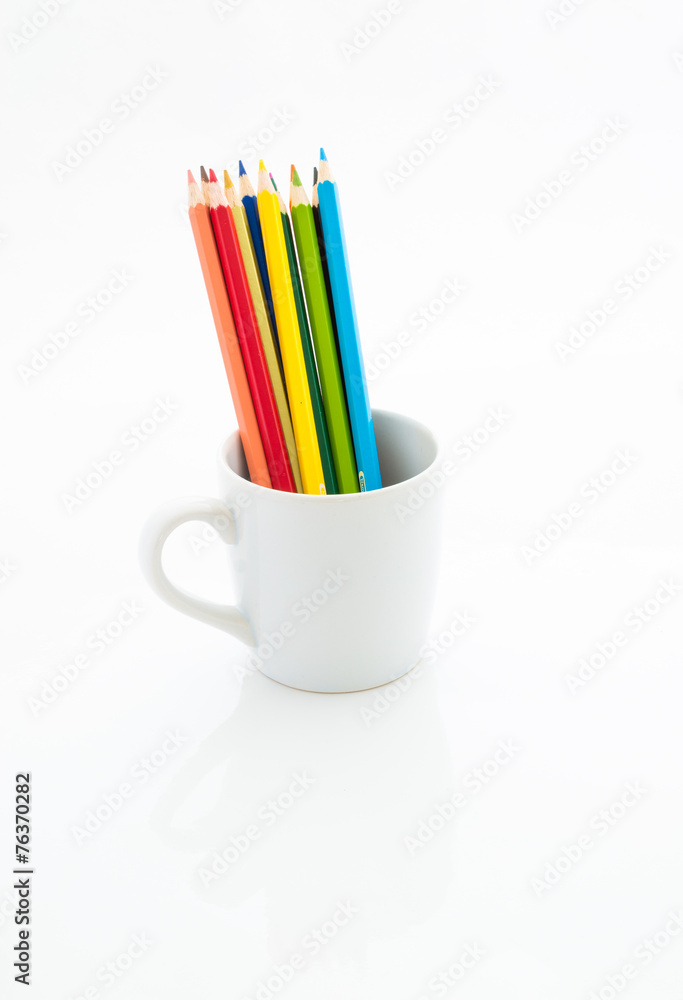 Color pencils in white coffee cup Color pencils in white coffee cup
