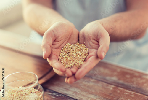 cloes up of male cupped hands with quinoa