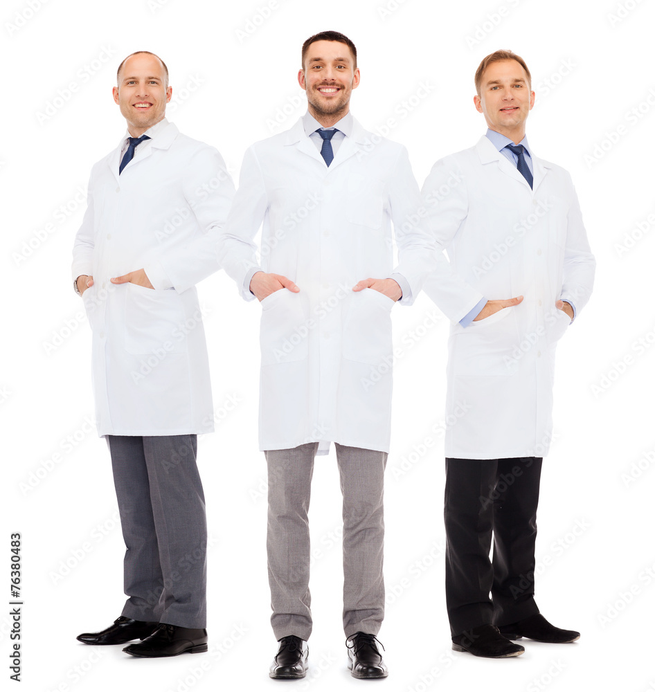 smiling male doctors in white coats smiling male doctors in white coats