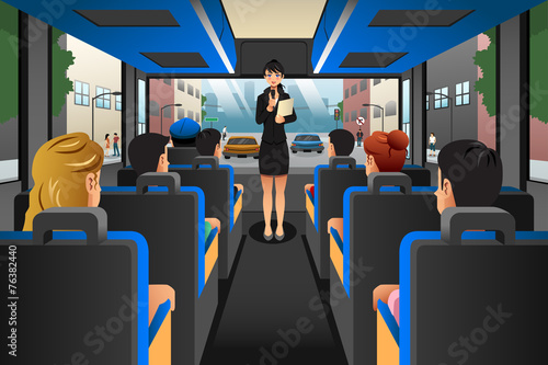 Tour guide talking to tourists in a tour bus