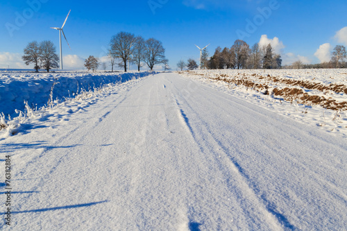 Winter landscape road snow covered fields windmills © Yotka