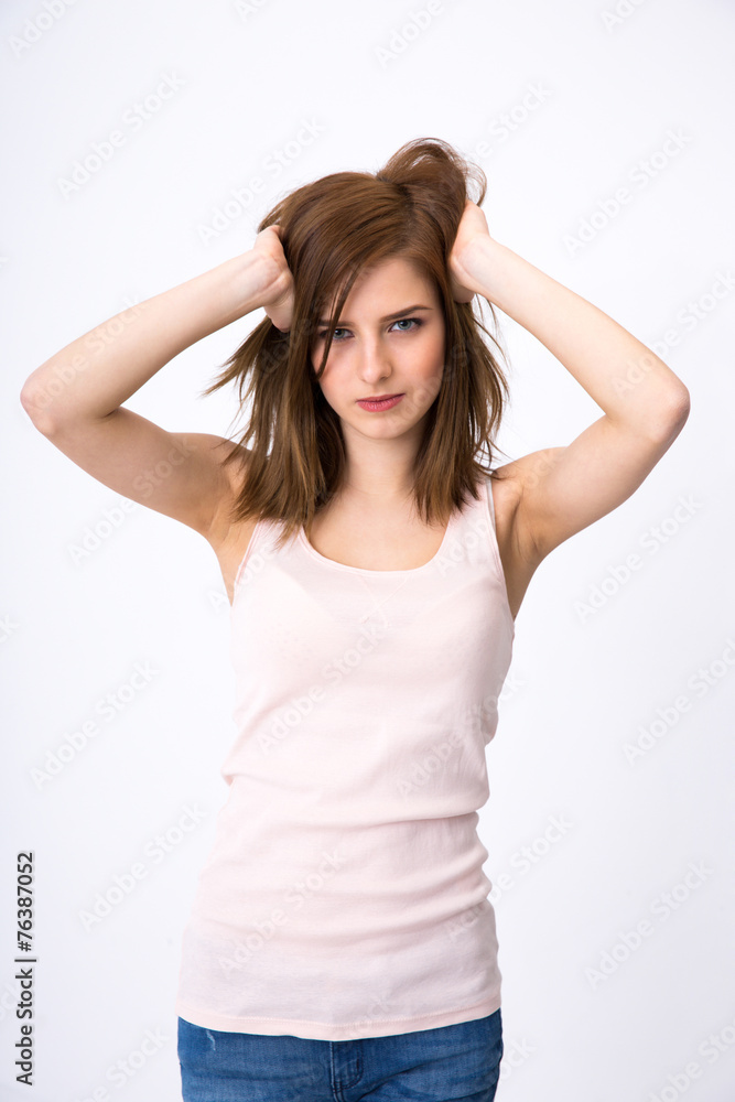 Portrait of attractive woman posing over gray background Portrait of attractive woman posing over gray background