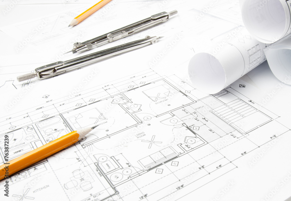 Construction blueprints on the worktable and drawing instrument Construction blueprints on the worktable and drawing instrument