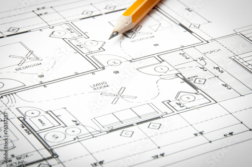 construction blueprints on the worktable and yellow pencil © gargantiopa