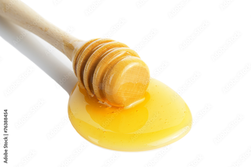 Honey droplets flowing from wooden stick. Honey droplets flowing from wooden stick.
