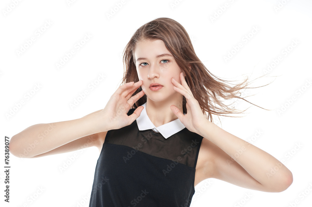 Young beautiful teenager girl with fluttering hair isolated Young beautiful teenager girl with fluttering hair isolated