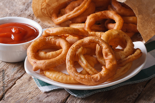 fried onion rings and ketchup close-up horizontal