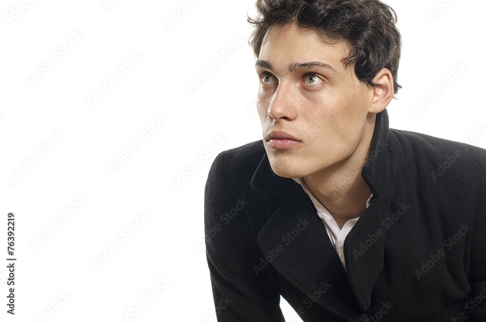 Portrait of a beautiful young man dressed in a black long coat, Portrait of a beautiful young man dressed in a black long coat,