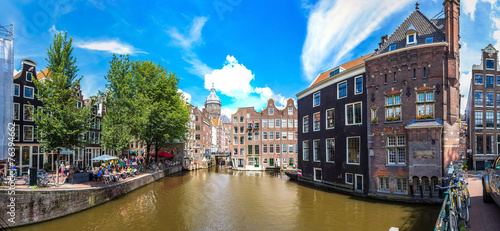 Photography Canal and St. Nicolas Church in Amsterdam