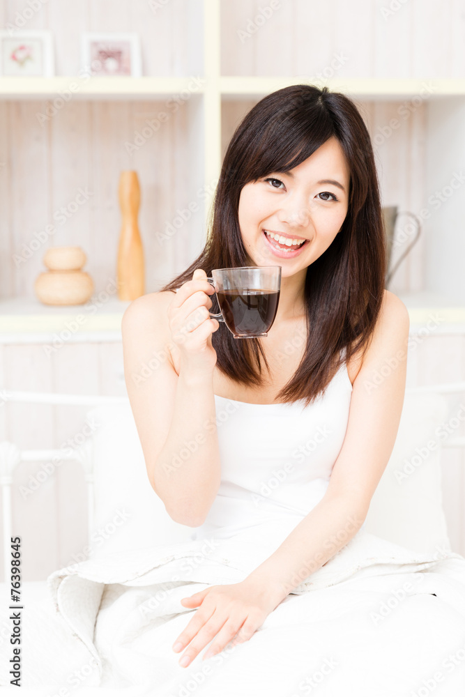 young asian woman relaxing in the bed room young asian woman relaxing in the bed room