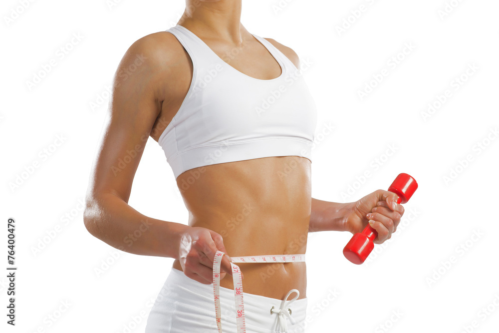 young athletic woman measuring waist young athletic woman measuring waist
