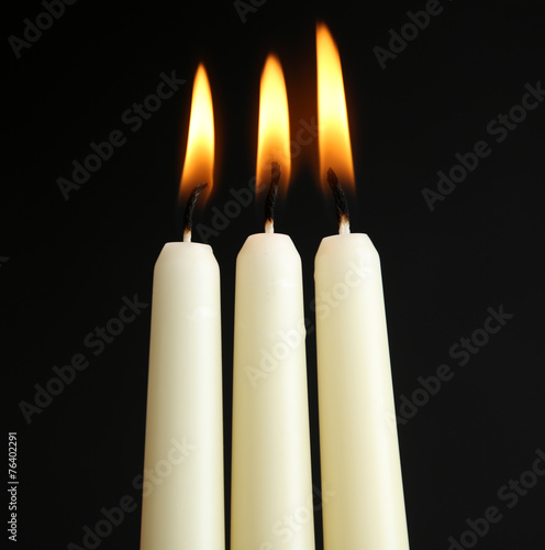 Candles on black background