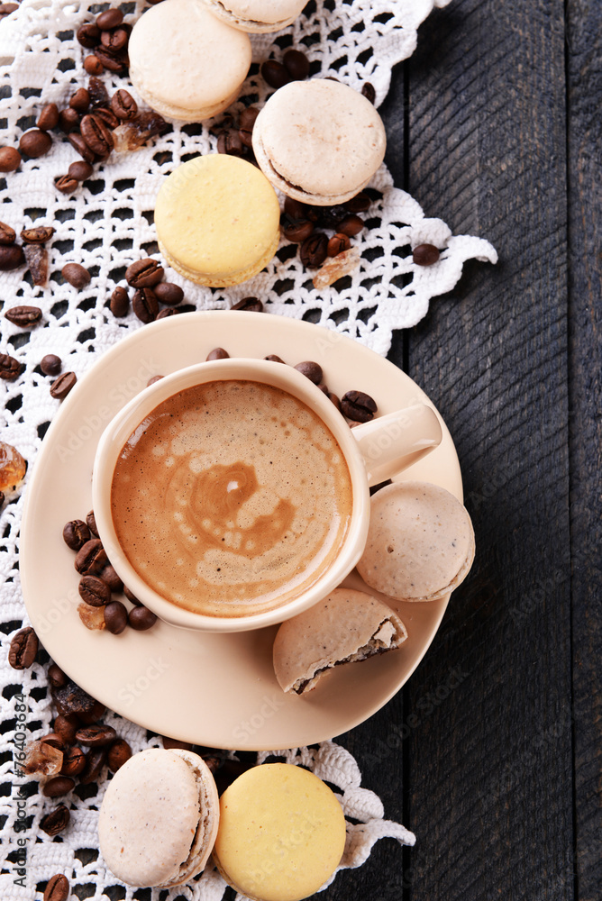 Gentle colorful macaroons and coffee in mug Gentle colorful macaroons and coffee in mug