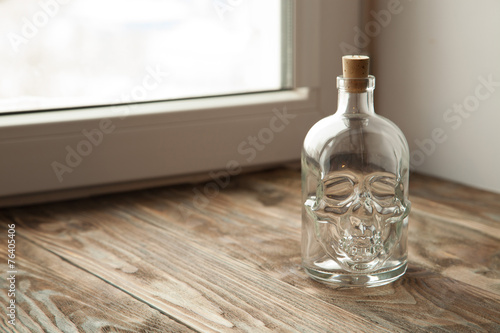 Bottle with a skull