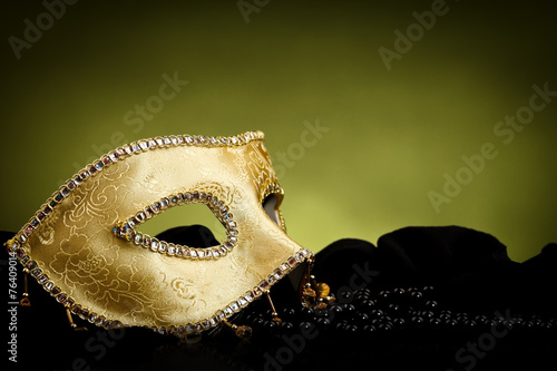 Golden mask over light background #76409014