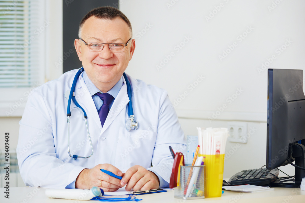 Portrait of Doctor with stethoscope looking at the camera. Portrait of Doctor with stethoscope looking at the camera.