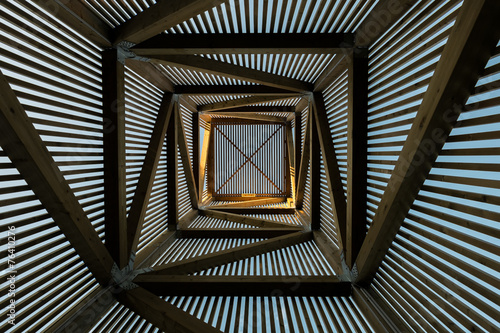 Foto Sun light from inside wood building
