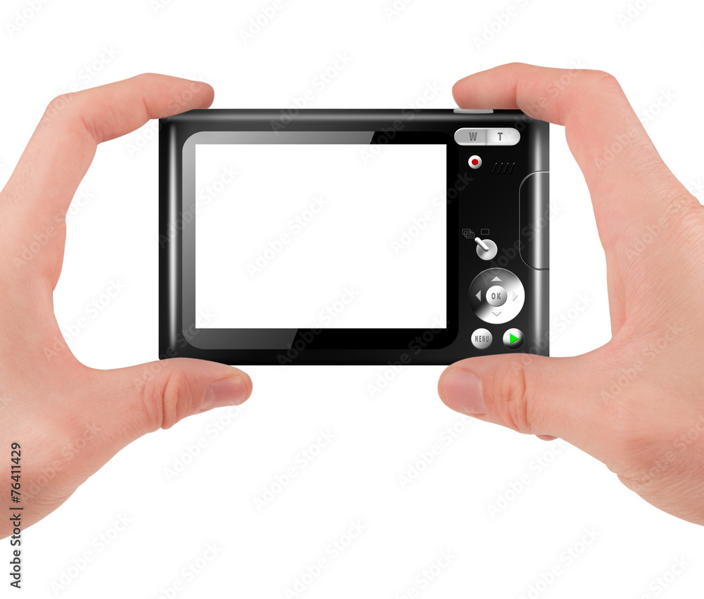 Hand holding a compact digital camera with empty LCD screen