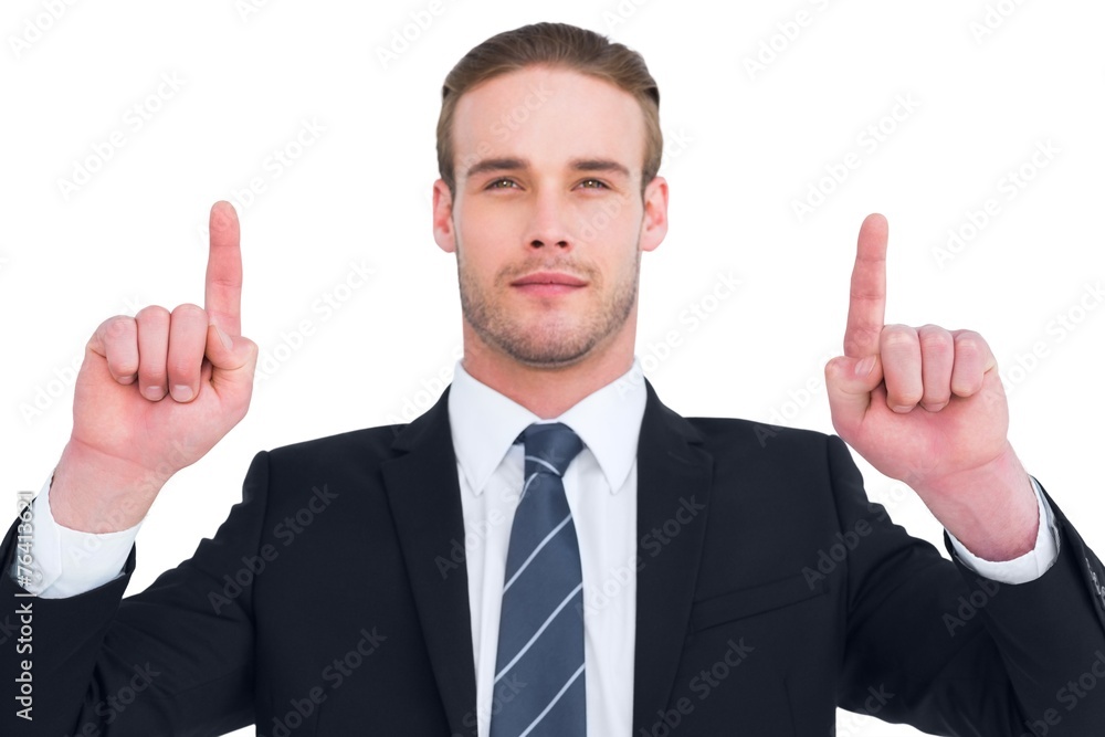 Serious businessman pointing up his fingers Serious businessman pointing up his fingers