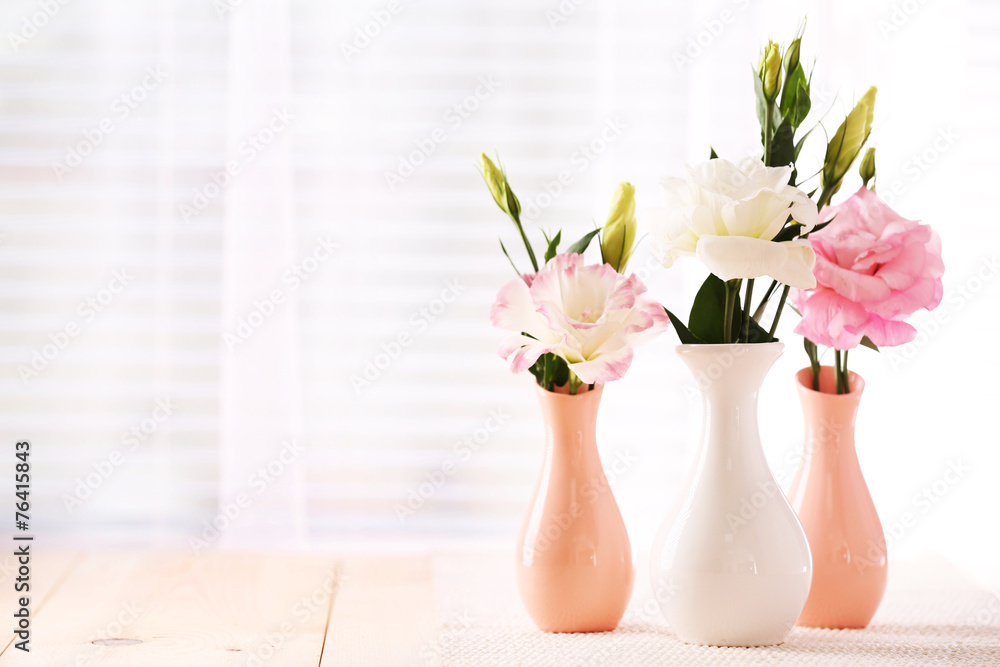 Beautiful flowers in vases with light from window Beautiful flowers in vases with light from window