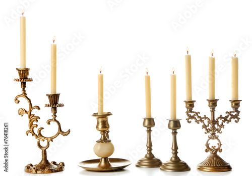 Retro candlesticks with candles, isolated on white photo