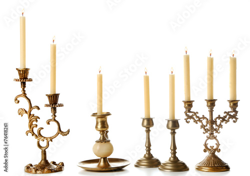 Photos Retro candlesticks with candles, isolated on white