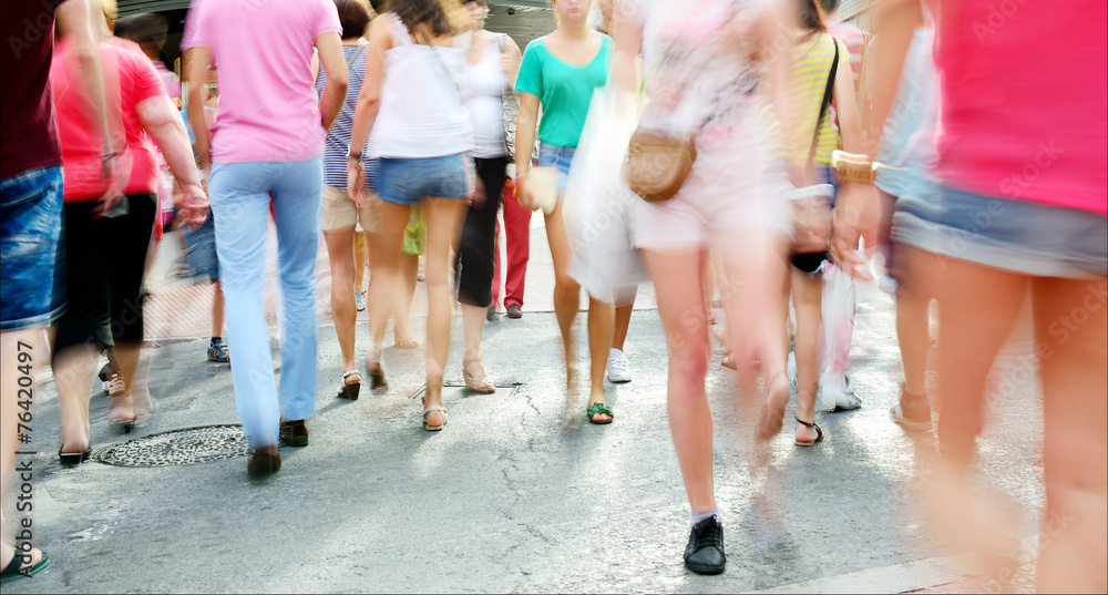 Fototapeta premium Motion blurred shoppers. Long time daytime blurred shot.